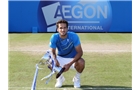 EASTBOURNE, ENGLAND - JUNE 21:  Feliciano Lopez of Spain celebrates with the trophy after beating Richard Gasquet of France during their Men's Singles Finals match on day eight of the Aegon International at Devonshire Park on June 21, 2014 in Eastbourne, England. (Photo by Jan Kruger/Getty Images)